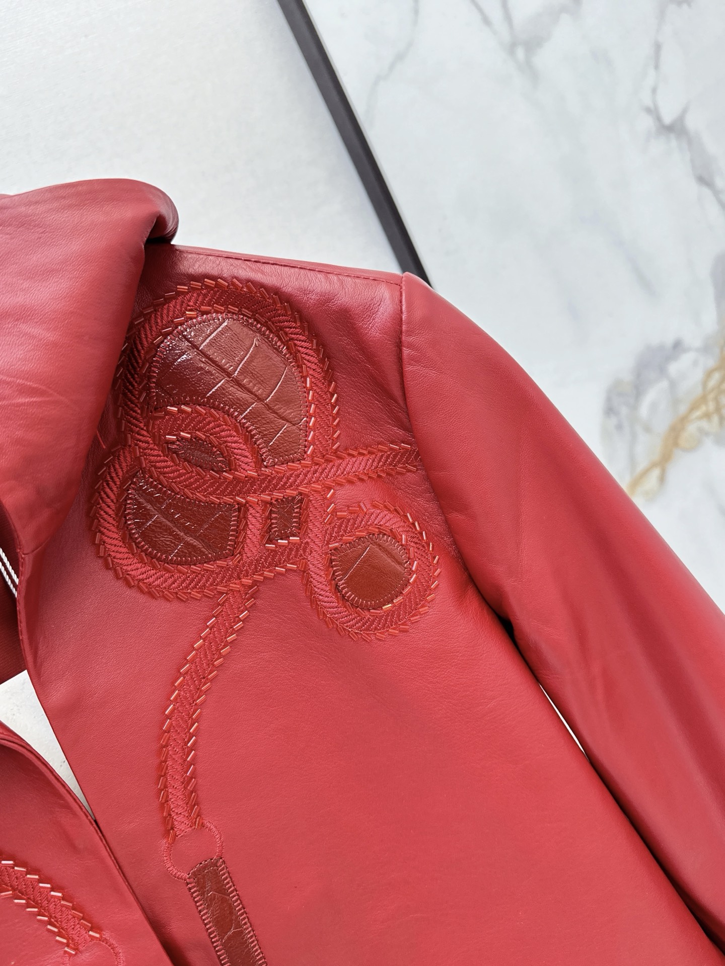 Her 26fw embroidery cropped leather jacket